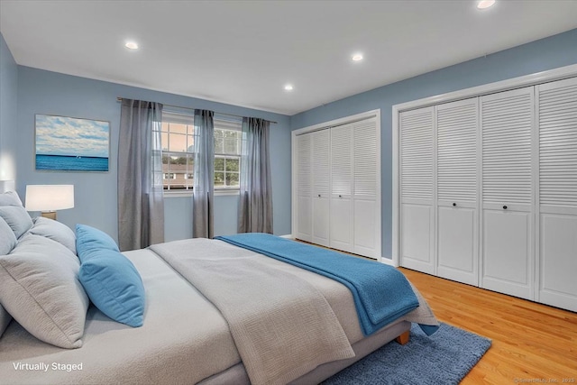 165 Hampton Ct Unit 165, Newington, CT 06111 - bedroom featuring light wood finished floors, two closets, and recessed lighting