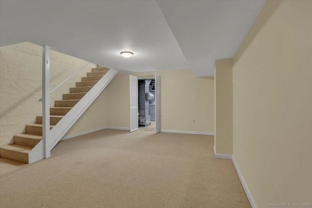 165 Hampton Ct Unit 165, Newington, CT 06111 - finished basement with light colored carpet, stairway, and baseboards