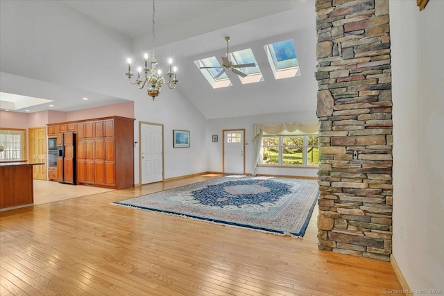 503 Dzen Way Unit 503, South Windsor, CT 06074 - foyer featuring a skylight, high vaulted ceiling, light wood-style floors, and a chandelier