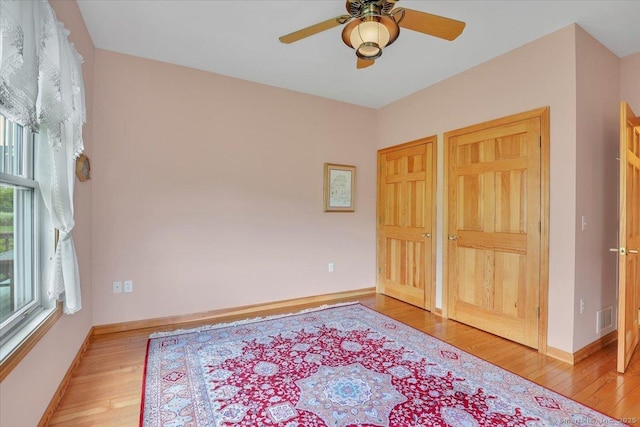 503 Dzen Way Unit 503, South Windsor, CT 06074 - unfurnished bedroom with light wood-style flooring and ceiling fan