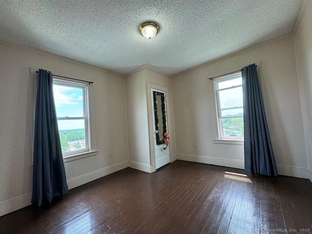 220 Kensington Ave, New Britain, CT 06051 - empty room with hardwood / wood-style flooring, a textured ceiling, crown molding, and baseboards