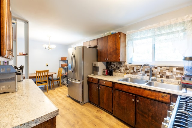 165 Scantic Meadow Rd, South Windsor, CT 06074 - kitchen with a sink, stainless steel fridge, light countertops, and light wood finished floors