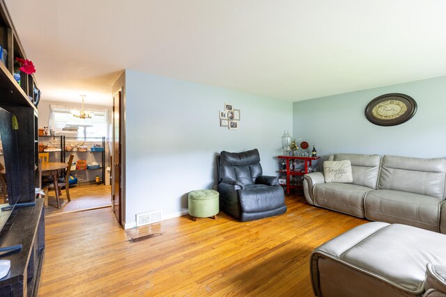 165 Scantic Meadow Rd, South Windsor, CT 06074 - living area with a chandelier and light wood-style floors