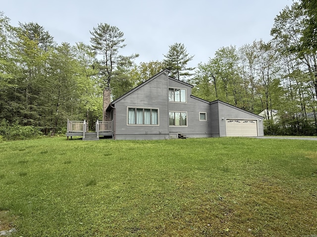 53 Bentley Cir, Goshen, CT 06756 - back of house featuring a chimney, a yard, a deck, and an attached garage