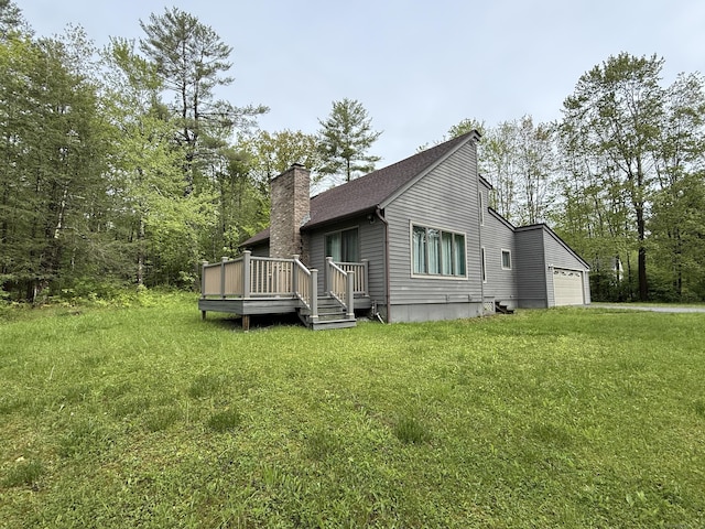 53 Bentley Cir, Goshen, CT 06756 - view of side of property with a chimney, a deck, a lawn, and a garage