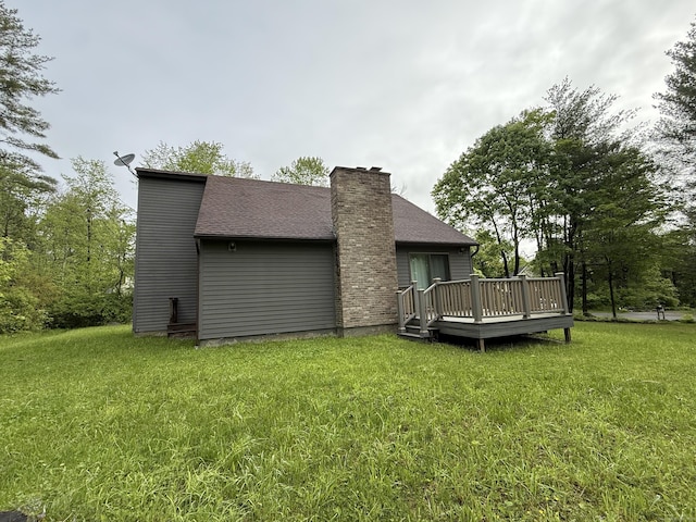 53 Bentley Cir, Goshen, CT 06756 - rear view of house with a wooden deck, a yard, and a chimney