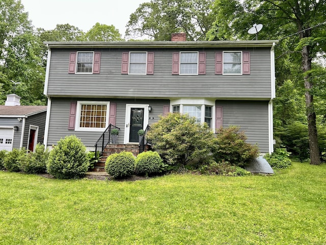 28 Blakeman Dr, Monroe, CT 06468 - colonial-style house with entry steps, a chimney, and a front yard