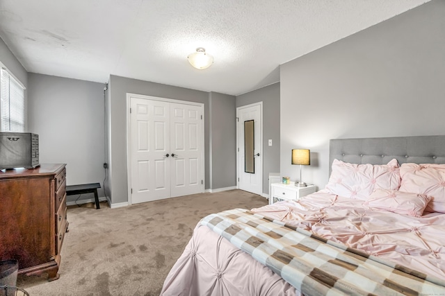 28 Blakeman Dr, Monroe, CT 06468 - carpeted bedroom with baseboards, a closet, and a textured ceiling