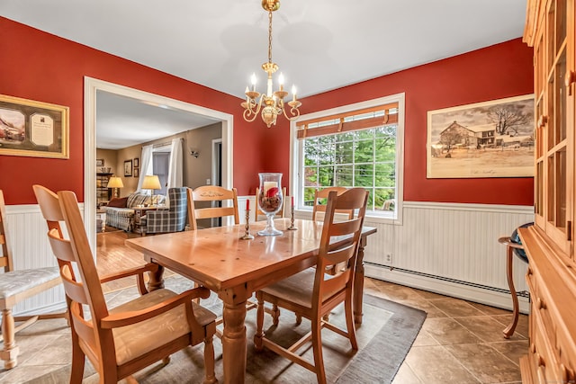 28 Blakeman Dr, Monroe, CT 06468 - tiled dining space featuring baseboard heating, a chandelier, and wainscoting