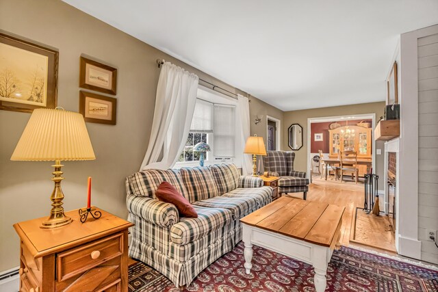 28 Blakeman Dr, Monroe, CT 06468 - living area with a baseboard radiator and a chandelier