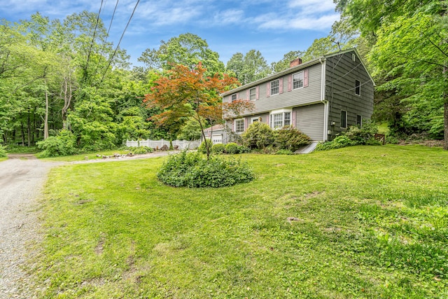 28 Blakeman Dr, Monroe, CT 06468 - view of home's exterior featuring a chimney and a yard