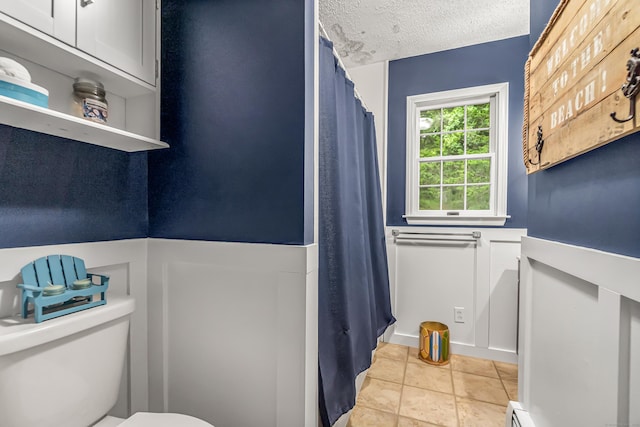 28 Blakeman Dr, Monroe, CT 06468 - bathroom with toilet, tile patterned flooring, a textured ceiling, and a shower with curtain
