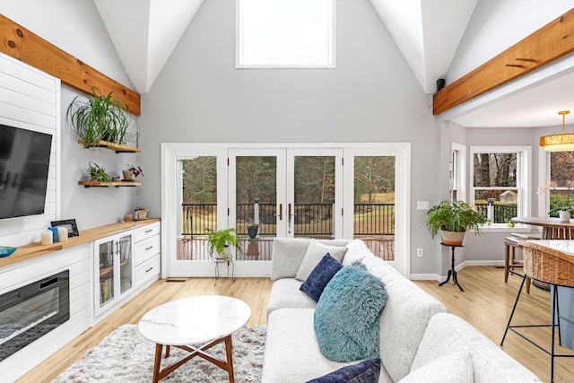 11 Pequot Ln, Hopkinton, Rhode Island, RI 02804 - living room with light wood finished floors and high vaulted ceiling
