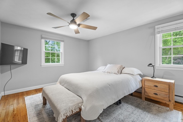 38 Rossie St, Stonington, CT 06355 - bedroom with multiple windows, light wood-type flooring, and a ceiling fan