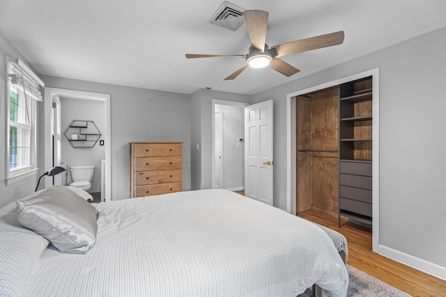 38 Rossie St, Stonington, CT 06355 - bedroom featuring light wood-style floors, a closet, a ceiling fan, and connected bathroom