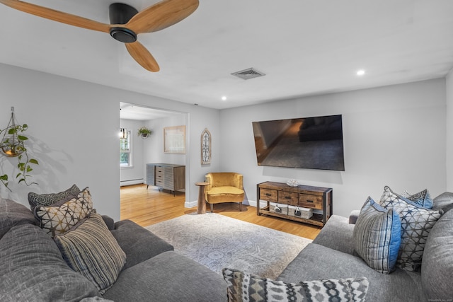 38 Rossie St, Stonington, CT 06355 - living room featuring wood finished floors, a baseboard radiator, a ceiling fan, and recessed lighting