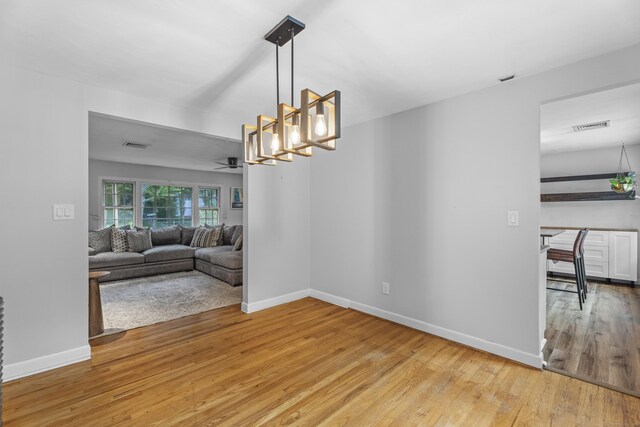 38 Rossie St, Stonington, CT 06355 - dining area with light wood-style flooring, ceiling fan, and a chandelier