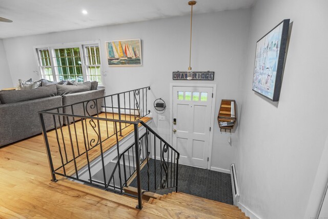 38 Rossie St, Stonington, CT 06355 - foyer entrance featuring wood finished floors, recessed lighting, and a baseboard heating unit