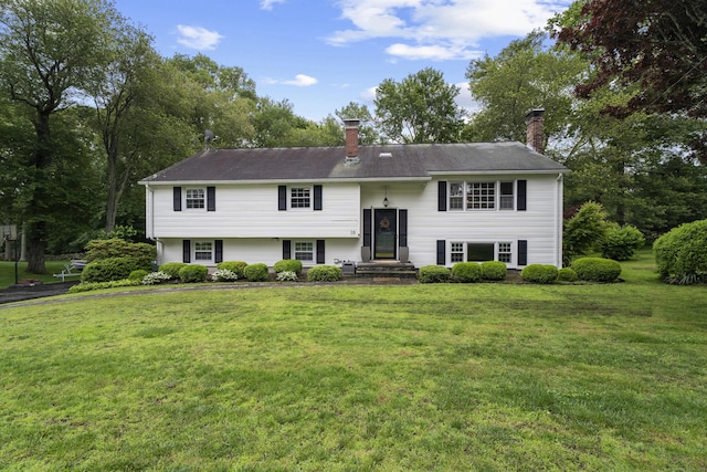 38 Rossie St, Stonington, CT 06355 - split foyer home featuring a chimney and a front lawn