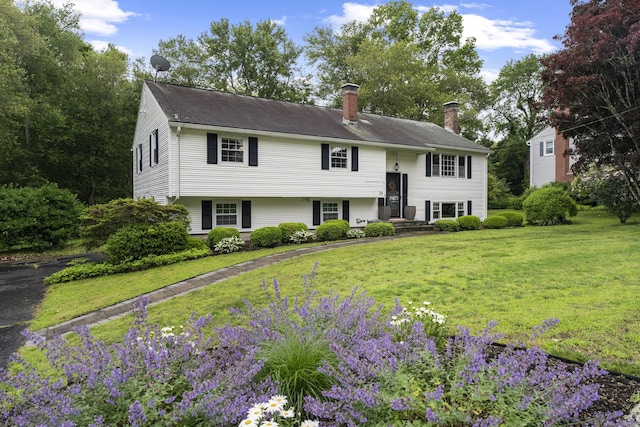 38 Rossie St, Stonington, CT 06355 - bi-level home featuring a chimney and a front lawn