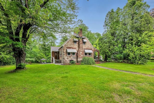 242 Park Ave, Bloomfield, CT 06002 - tudor-style house with a chimney and a front lawn