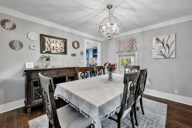 242 Park Ave, Bloomfield, CT 06002 - dining area featuring a chandelier, baseboards, ornamental molding, and dark wood-type flooring