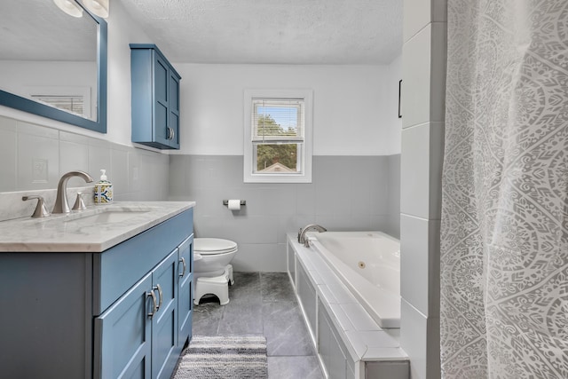 242 Park Ave, Bloomfield, CT 06002 - full bathroom with vanity, toilet, a tub with jets, tile walls, and a textured ceiling