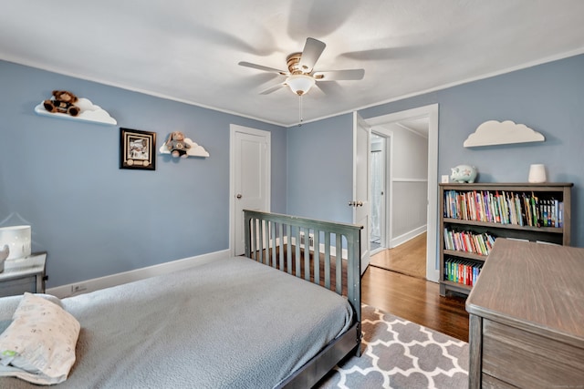 242 Park Ave, Bloomfield, CT 06002 - bedroom with wood finished floors, baseboards, and ceiling fan
