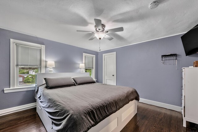 242 Park Ave, Bloomfield, CT 06002 - bedroom with baseboards, wood finished floors, ceiling fan, and a textured ceiling
