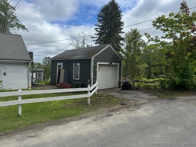 21 Clinic Rd, Pomfret, CT 06230 - detached garage featuring asphalt driveway