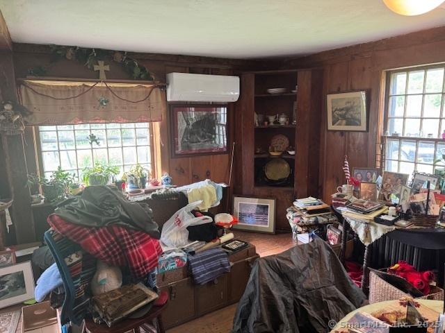 21 Clinic Rd, Pomfret, CT 06230 - misc room featuring a wall mounted AC and wood walls