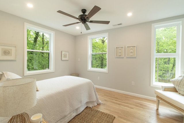 708 County Rd, Guilford, CT 06437 - bedroom with baseboards, light wood finished floors, multiple windows, recessed lighting, and a ceiling fan