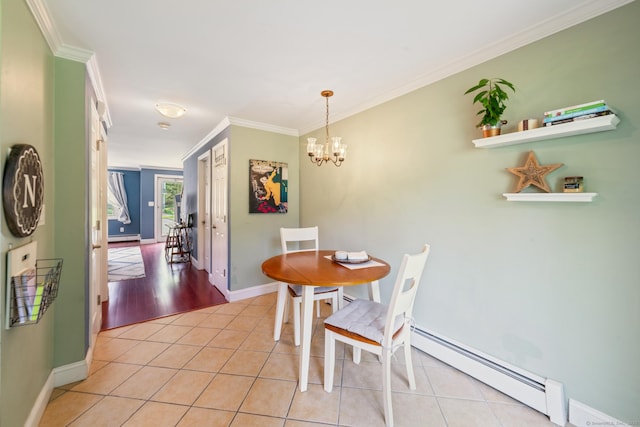 148 Fairway Dr Unit 148, Cheshire, CT 06410 - dining room with baseboard heating, ornamental molding, light tile patterned floors, a chandelier, and baseboards