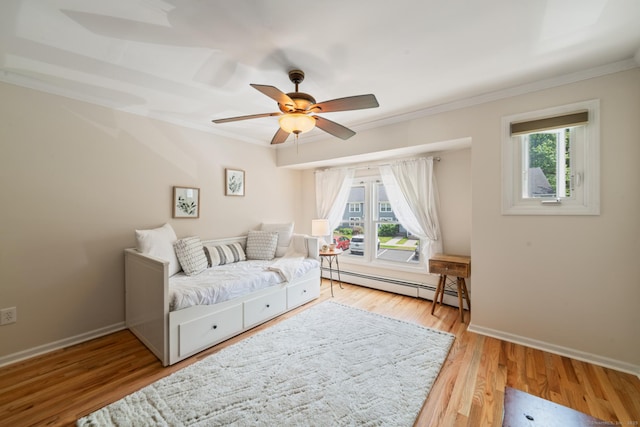148 Fairway Dr Unit 148, Cheshire, CT 06410 - bedroom featuring a baseboard heating unit, crown molding, multiple windows, wood finished floors, and baseboards