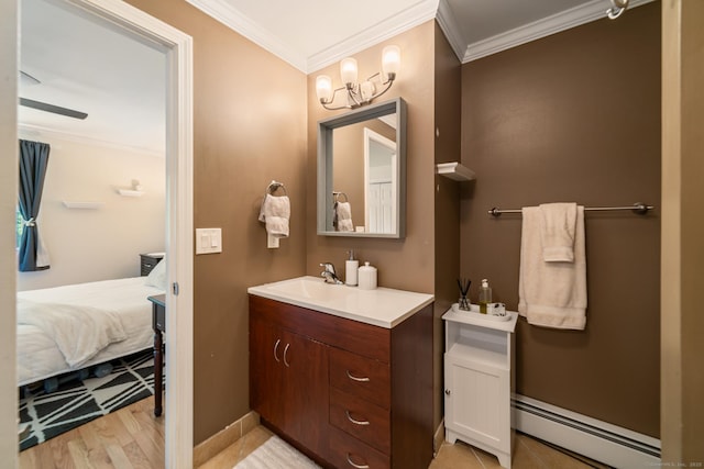 148 Fairway Dr Unit 148, Cheshire, CT 06410 - ensuite bathroom featuring a baseboard heating unit, vanity, crown molding, wood finished floors, and a chandelier