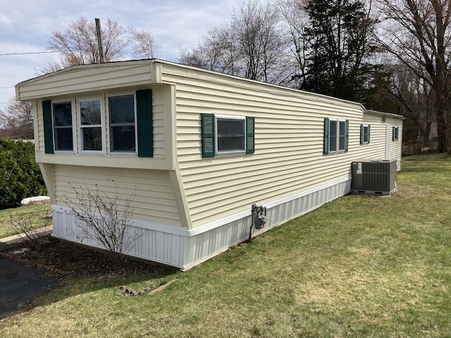 7 Cedar Grove Rd, Southington, CT 06489 - view of home's exterior featuring cooling unit and a lawn