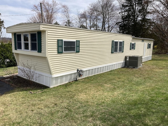 7 Cedar Grove Rd, Southington, CT 06489 - view of side of home with central AC and a lawn