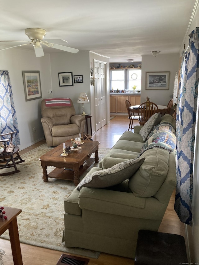 7 Cedar Grove Rd, Southington, CT 06489 - living room with ceiling fan, wood finished floors, and baseboards