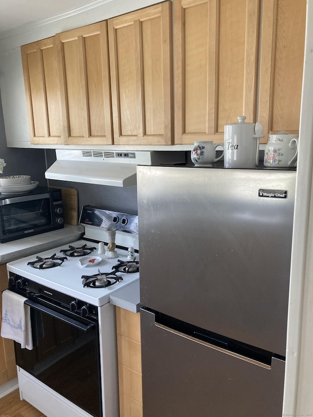 7 Cedar Grove Rd, Southington, CT 06489 - kitchen with range with gas cooktop, freestanding refrigerator, black microwave, and under cabinet range hood
