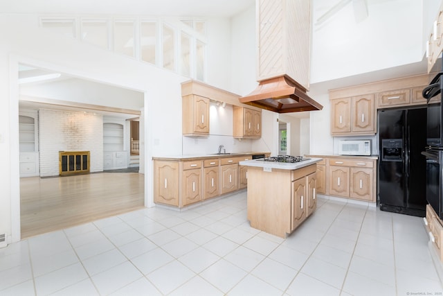39 Chestnut Hill Rd, Simsbury, CT 06092 - kitchen with black appliances, a towering ceiling, a kitchen island, light brown cabinets, and light countertops
