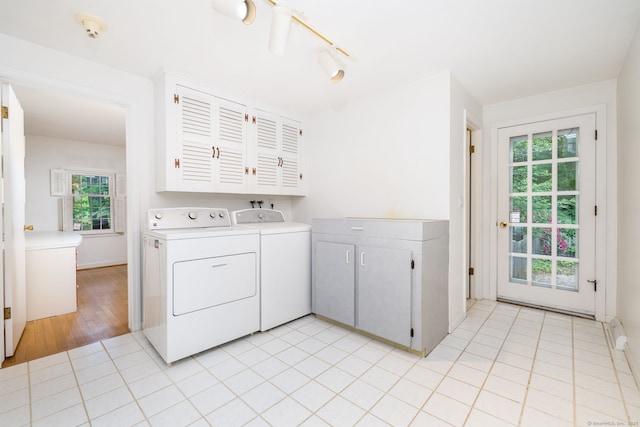 39 Chestnut Hill Rd, Simsbury, CT 06092 - washroom featuring cabinet space, washer and clothes dryer, and light tile patterned flooring