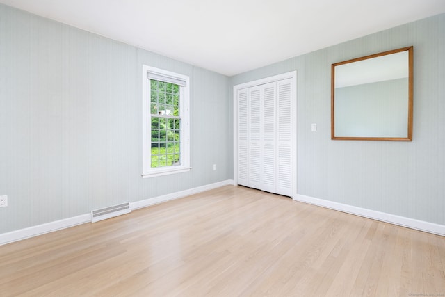 39 Chestnut Hill Rd, Simsbury, CT 06092 - unfurnished bedroom with wood finished floors, a closet, and baseboards