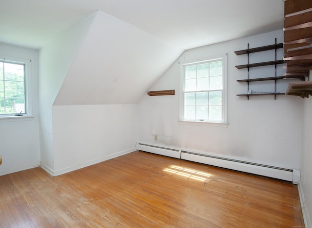 106 Hedgehog Ln, Simsbury, CT 06092 - bonus room with a baseboard heating unit, light wood-type flooring, healthy amount of natural light, vaulted ceiling, and baseboards