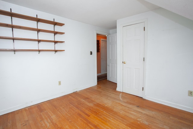 106 Hedgehog Ln, Simsbury, CT 06092 - unfurnished bedroom with light wood-type flooring and baseboards