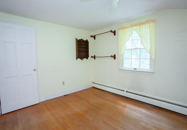 106 Hedgehog Ln, Simsbury, CT 06092 - empty room featuring a baseboard radiator, wood finished floors, and ceiling fan