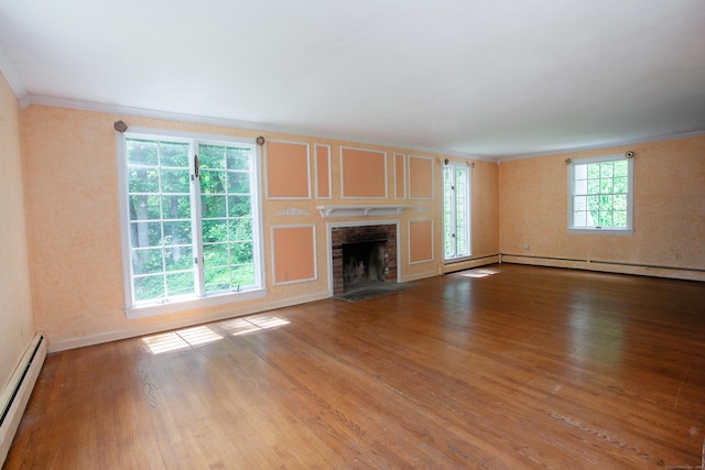 106 Hedgehog Ln, Simsbury, CT 06092 - unfurnished living room featuring a baseboard radiator, ornamental molding, baseboard heating, wood finished floors, and a fireplace with flush hearth