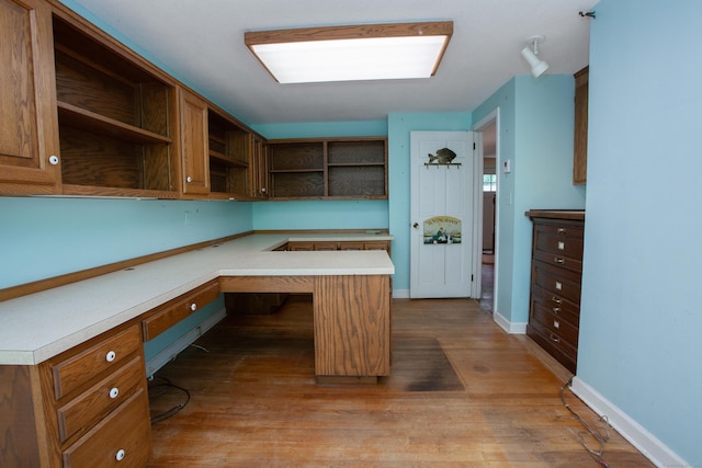 106 Hedgehog Ln, Simsbury, CT 06092 - unfurnished office with built in study area, wood finished floors, and baseboards