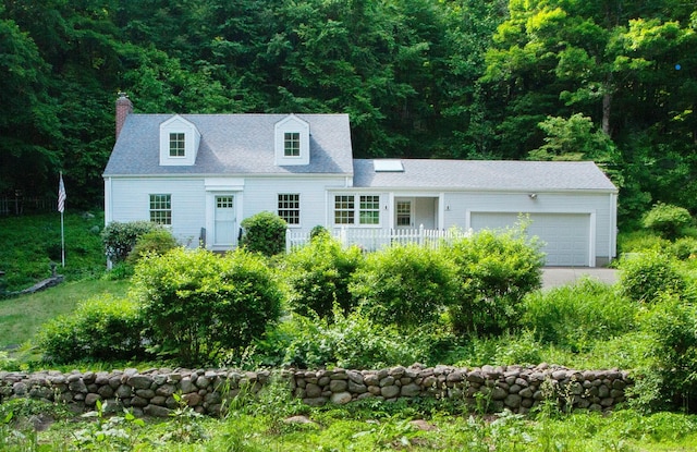 106 Hedgehog Ln, Simsbury, CT 06092 - cape cod-style house with a chimney, a garage, driveway, and a forest view