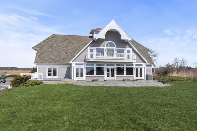 379 Whitfield St Unit Bs1138, Guilford, CT 06437 - back of property with french doors, a balcony, a patio area, a yard, and central air condition unit