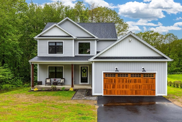91 Corbin Rdg, Bristol, CT 06010 - view of front of home featuring covered porch, a shingled roof, a garage, driveway, and a front lawn
